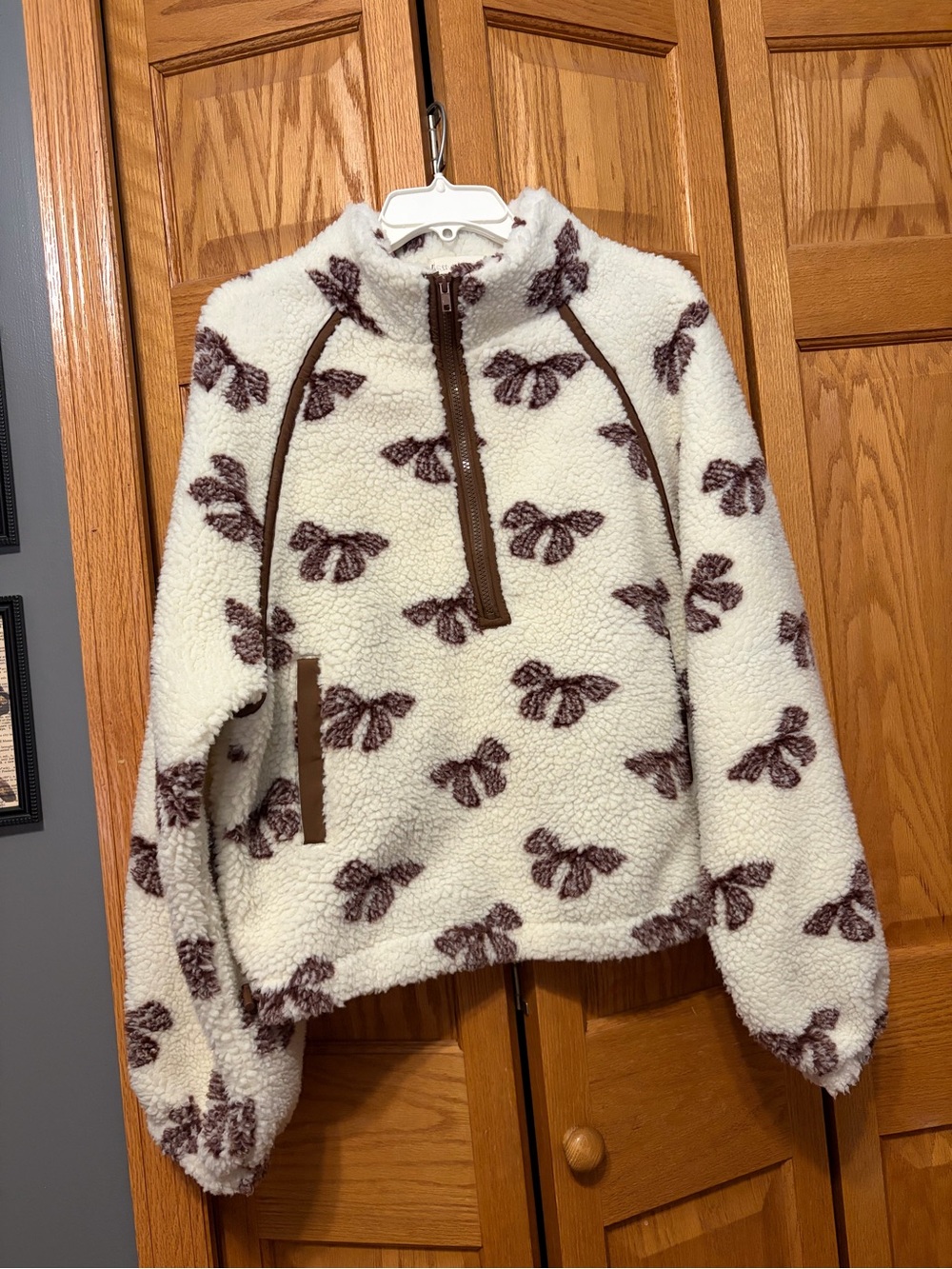 Cozy Cream Sherpa Half-Zip Pullover with Brown Bow Print